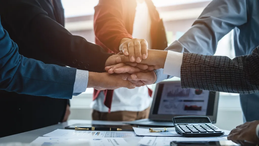 person hiring a personal injury lawyer at an office and shaking hands