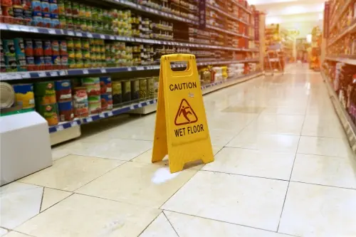 silp and fall sign in a store