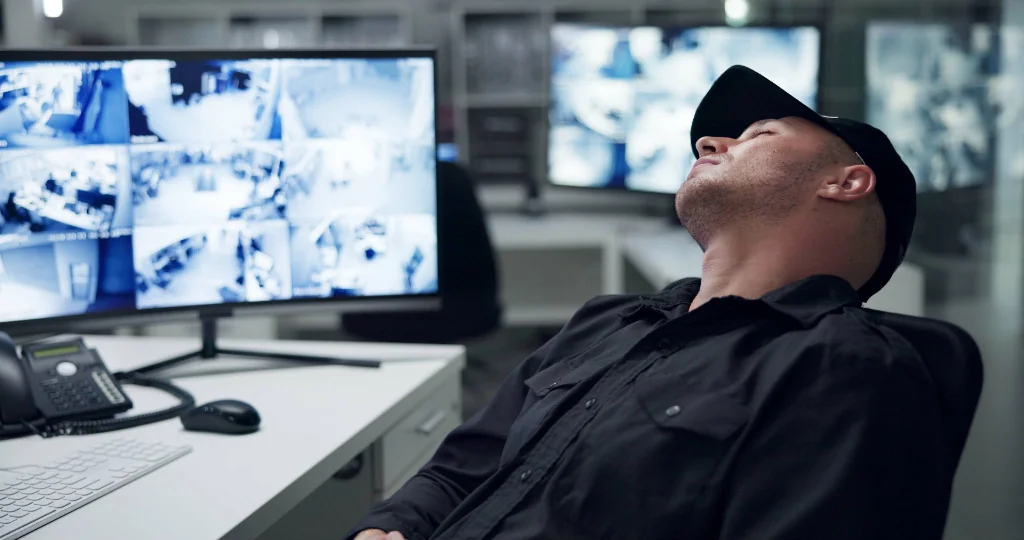 negligent security guard sleeping on the job near monitors