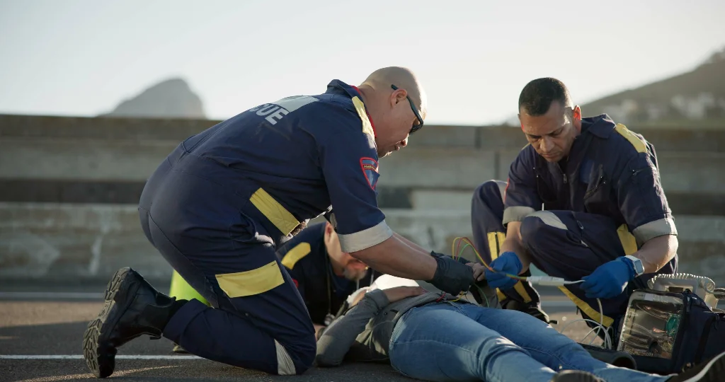 Pedestrian accident paramedics providing medical treatment