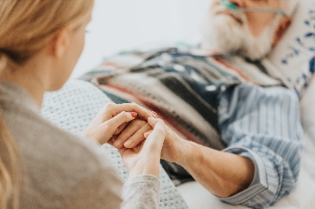 People Holding Hands After Wrongful Death At A Nursing Home
