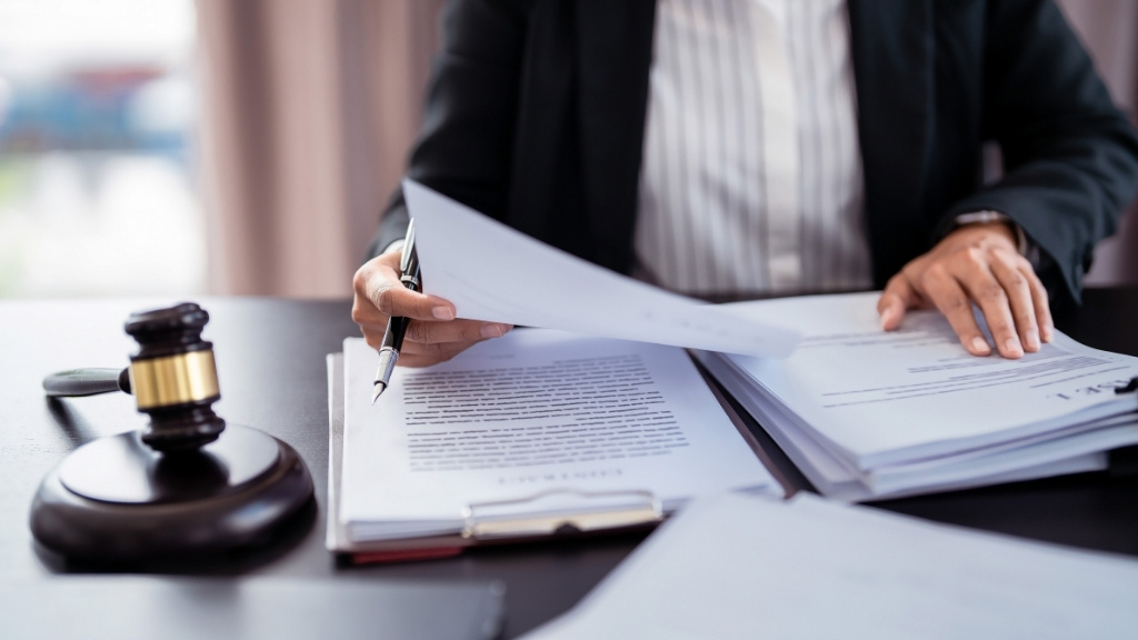 Lawyer reviewing papers on Strict Liability